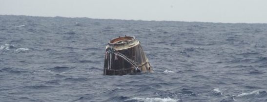 (31 May 2012) --- First picture from the Pacific showing the SpaceX Drgon following its splashdown. Photo credit: Michael Altenhofen/SpaceX